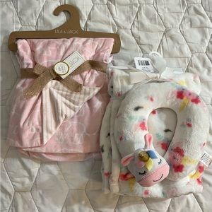 Pink elephant baby blanket and white unicorn blanket with matching pillow.